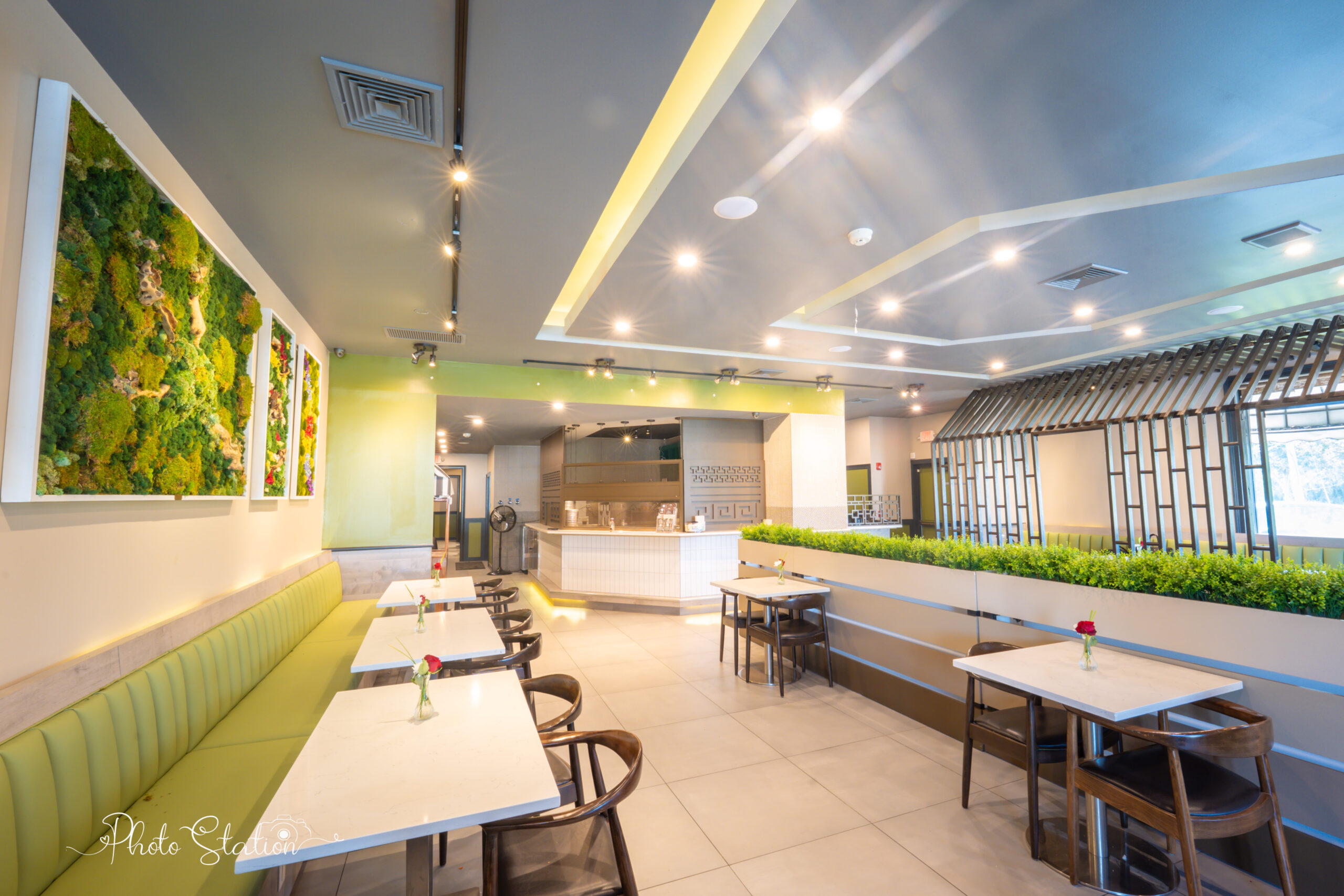 Elegant and modern interior dining room layout of Brundhavan pure vegetarian Indian restaurant with stylish booth seating and warm lighting.